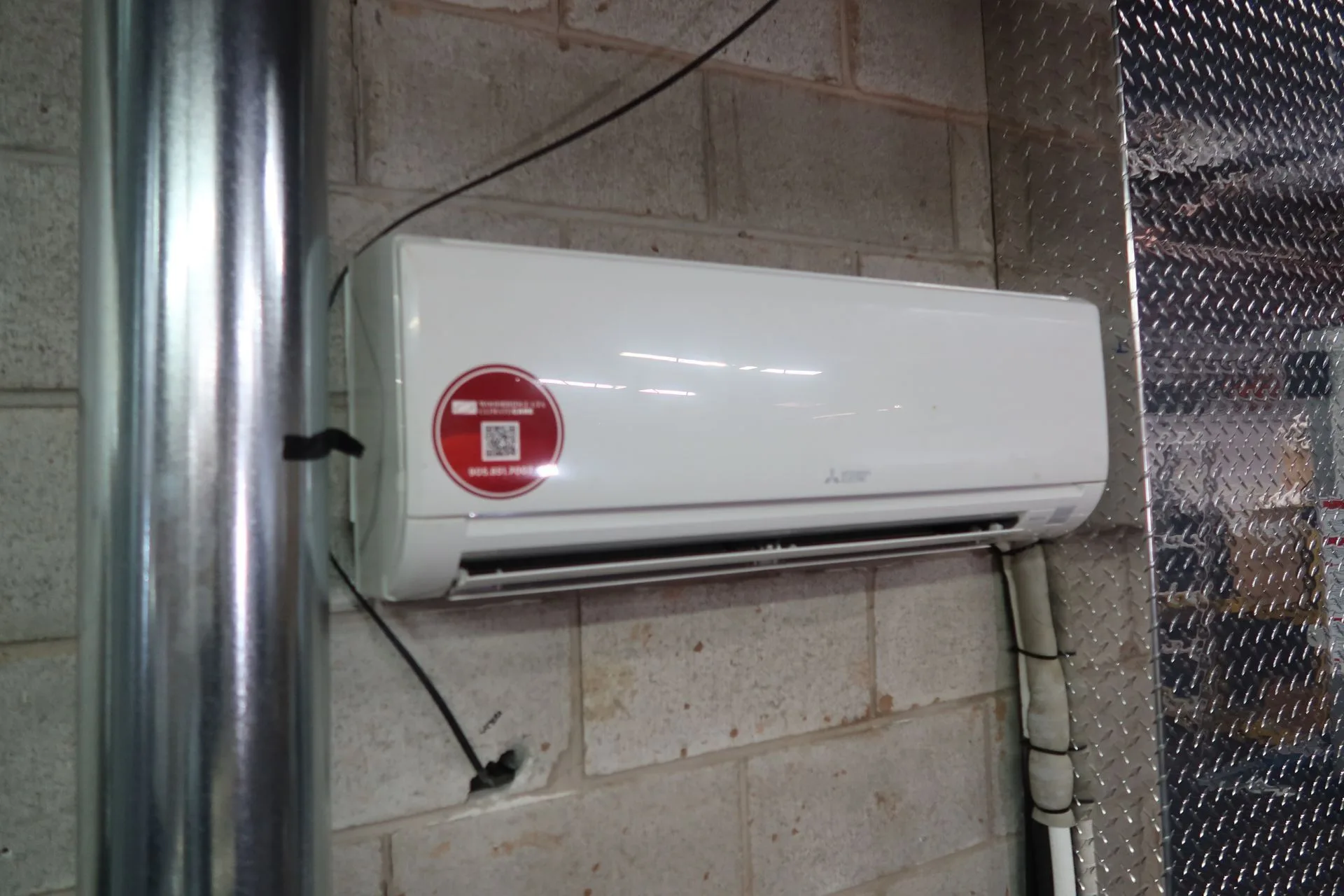 Ductless air conditioner mounted on a wall.