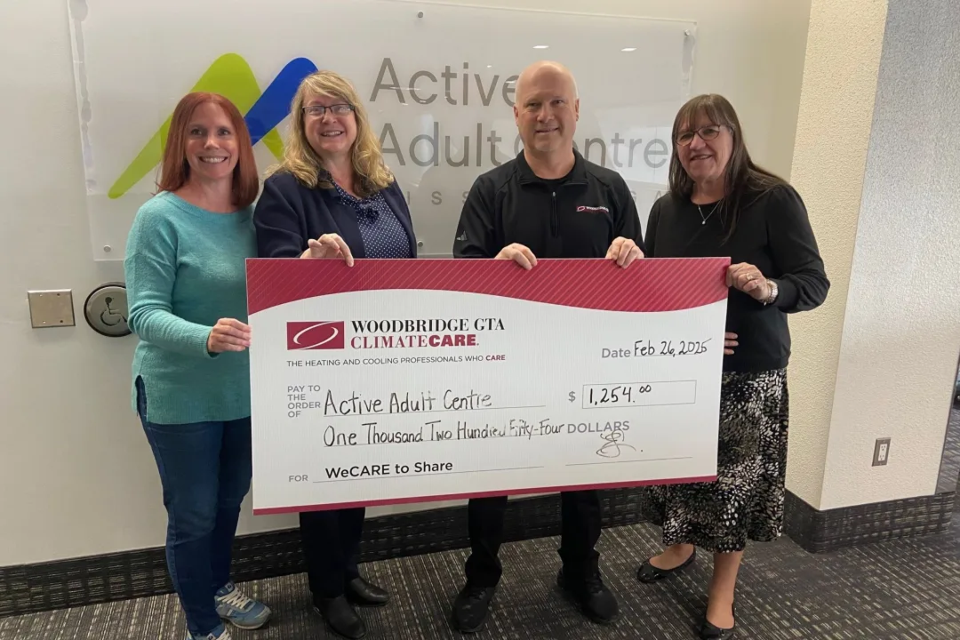 Woodbridge GTA ClimateCare presenting a donation check.