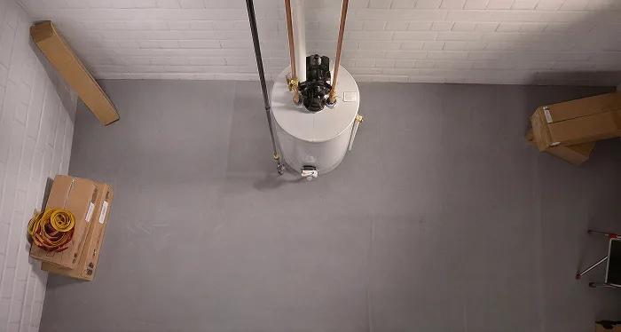 Top view of a silver water tank in a minimal space.