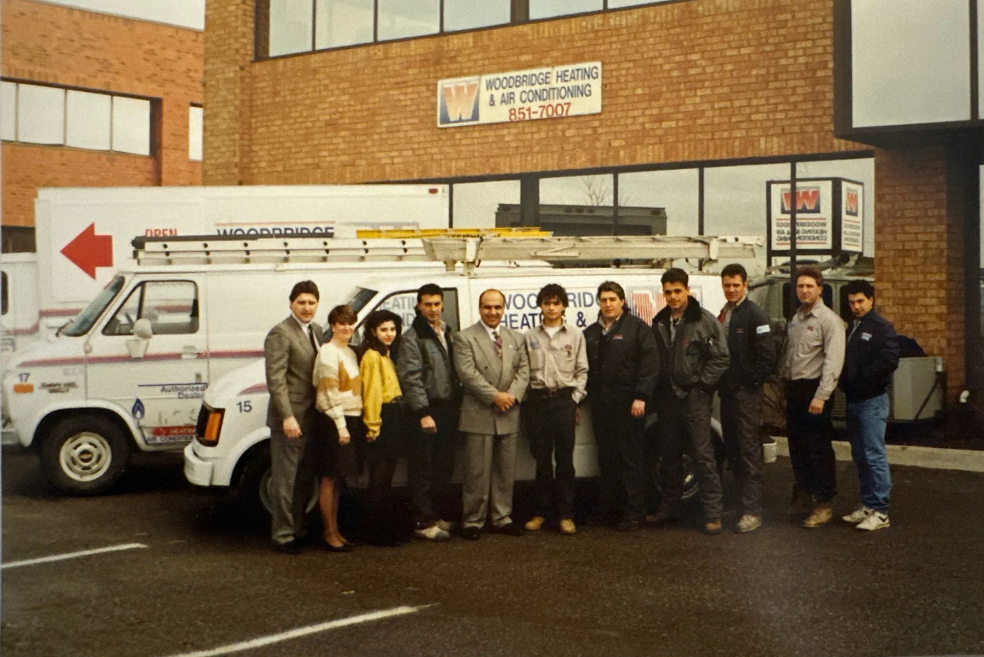 Team photo outside a Woodbridge heating and air conditioning service van.