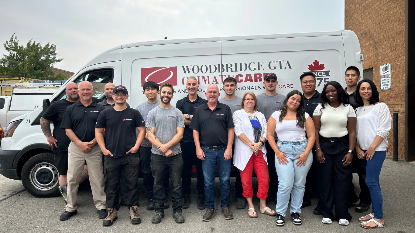 HVAC service team in front of their company van.