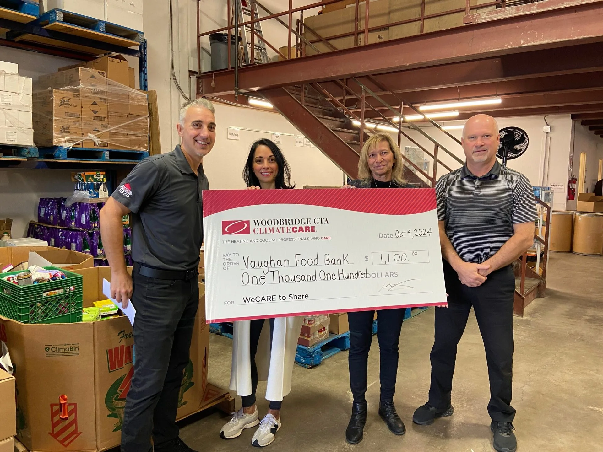 Representatives presenting a check to Vaughan Food Bank.