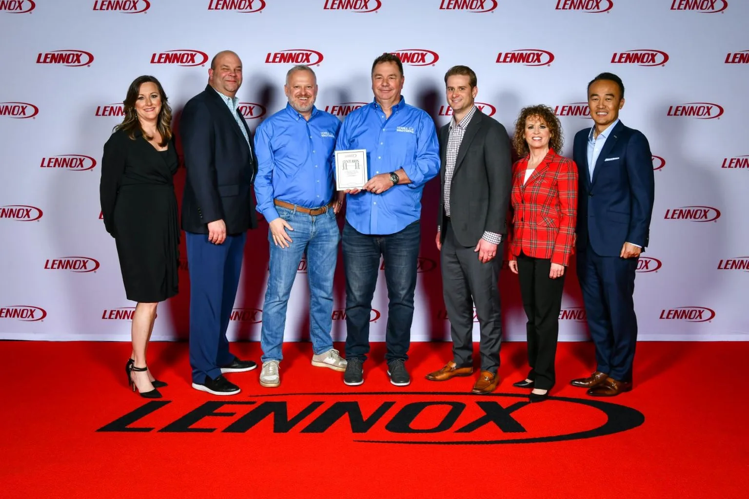 Group photo of award recipients at a LENNOX event.