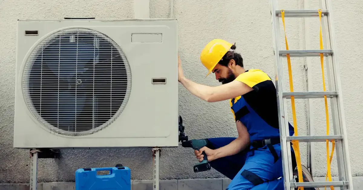 HVAC technician working on an air conditioning unit.