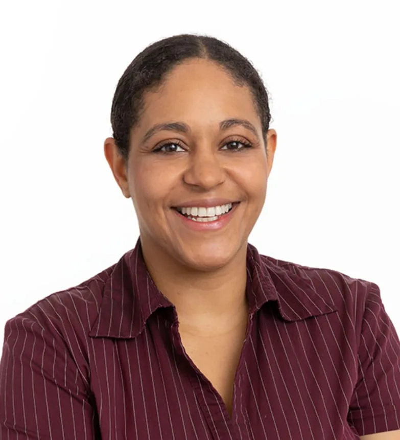 Smiling woman in a maroon pinstriped shirt