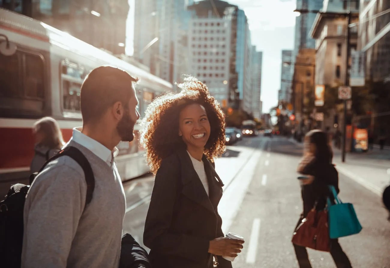 A couple enjoying a stroll on a city street.