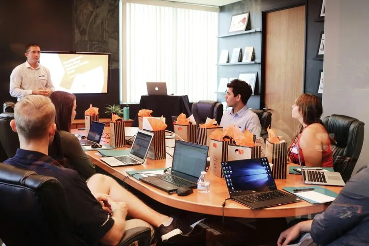 Business meeting with presentation in a conference room.