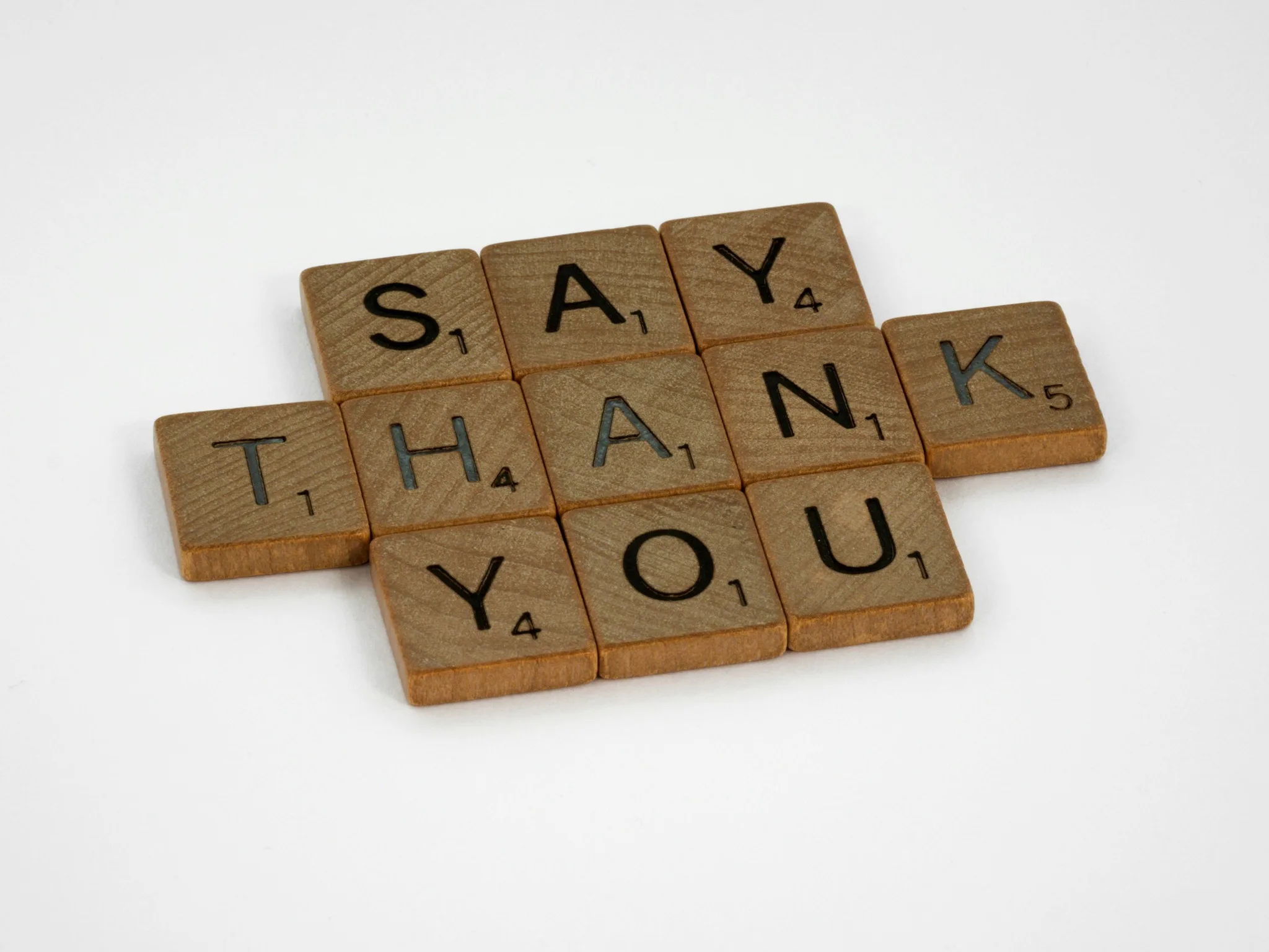 Wooden tiles spelling 'SAY THANK YOU'