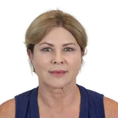 A woman with a smooth complexion against a white background.