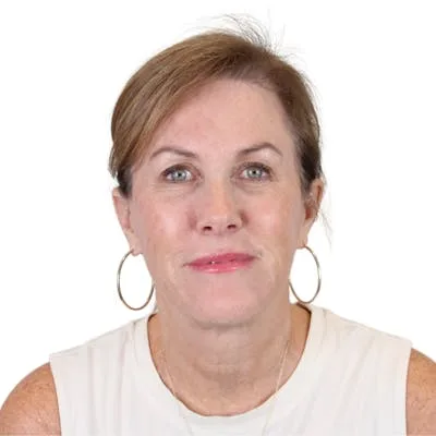 A woman posing against a white background.