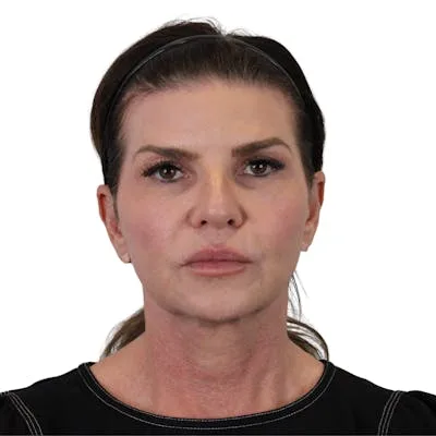 A woman with dark hair in a black top.
