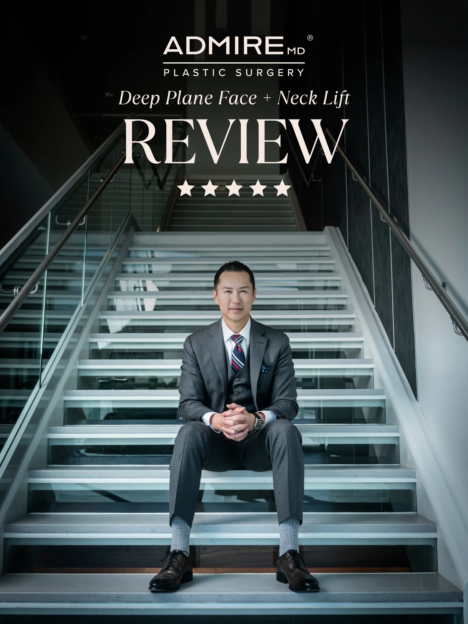 A man in a suit sitting on stairs with a review text behind him.