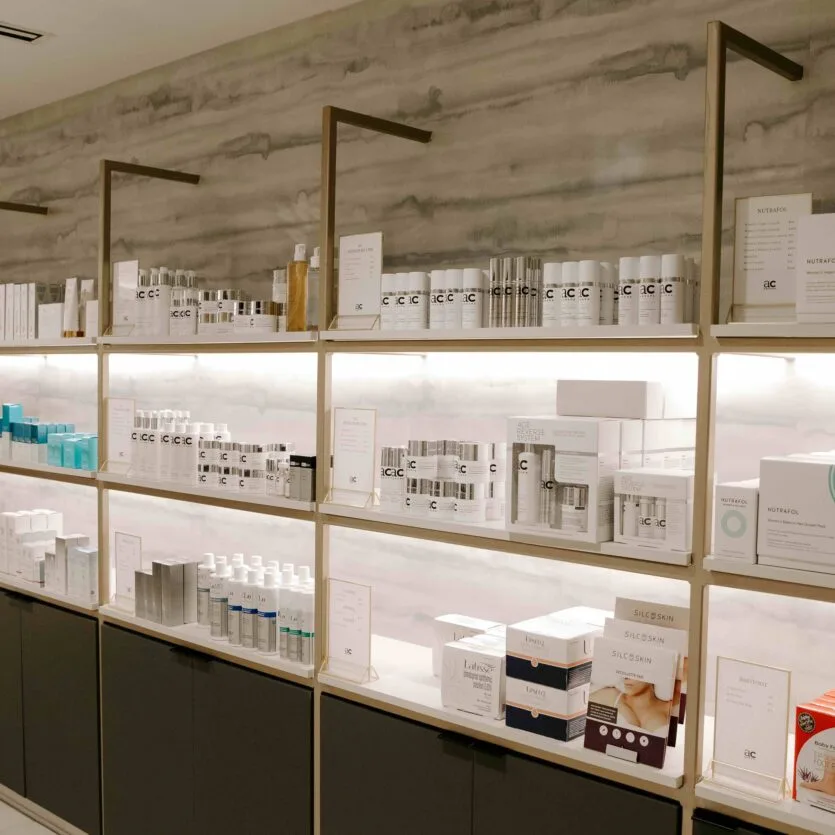 Skincare and beauty products displayed neatly on shelves.