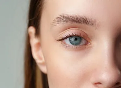 Close-up of a young woman's eye and face.