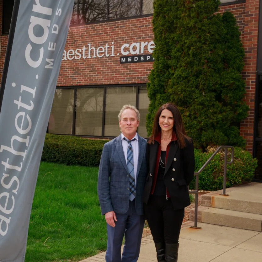 Two professionals outside AesthetiCare Medspa in Kansas City.