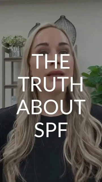 A woman discussing sun protection in a spa setting.