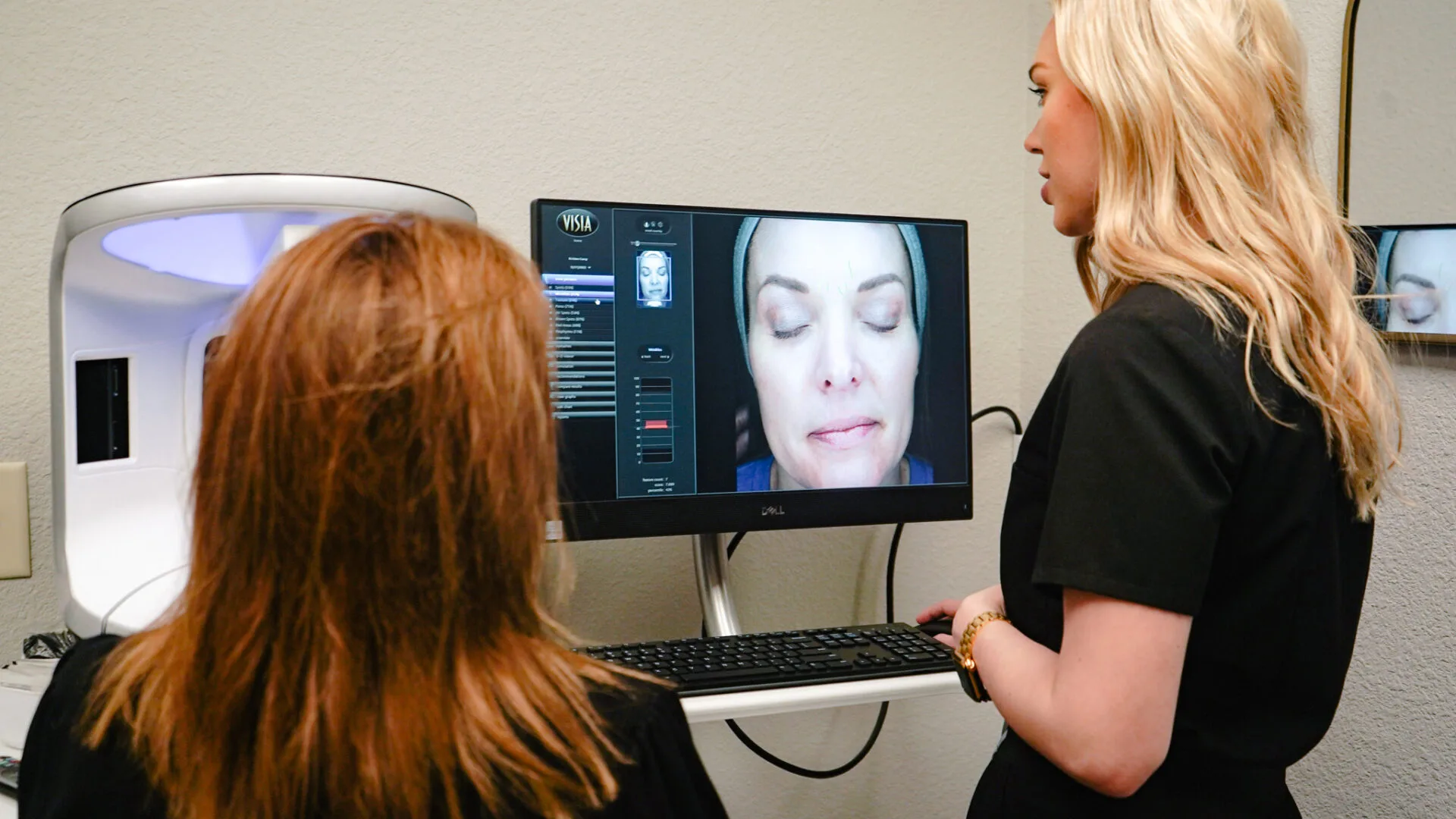 Two women in a medspa consultation session.