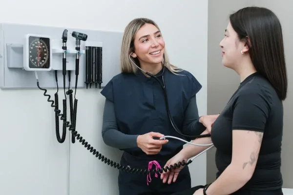 Healthcare professional conducting a check-up with a patient.