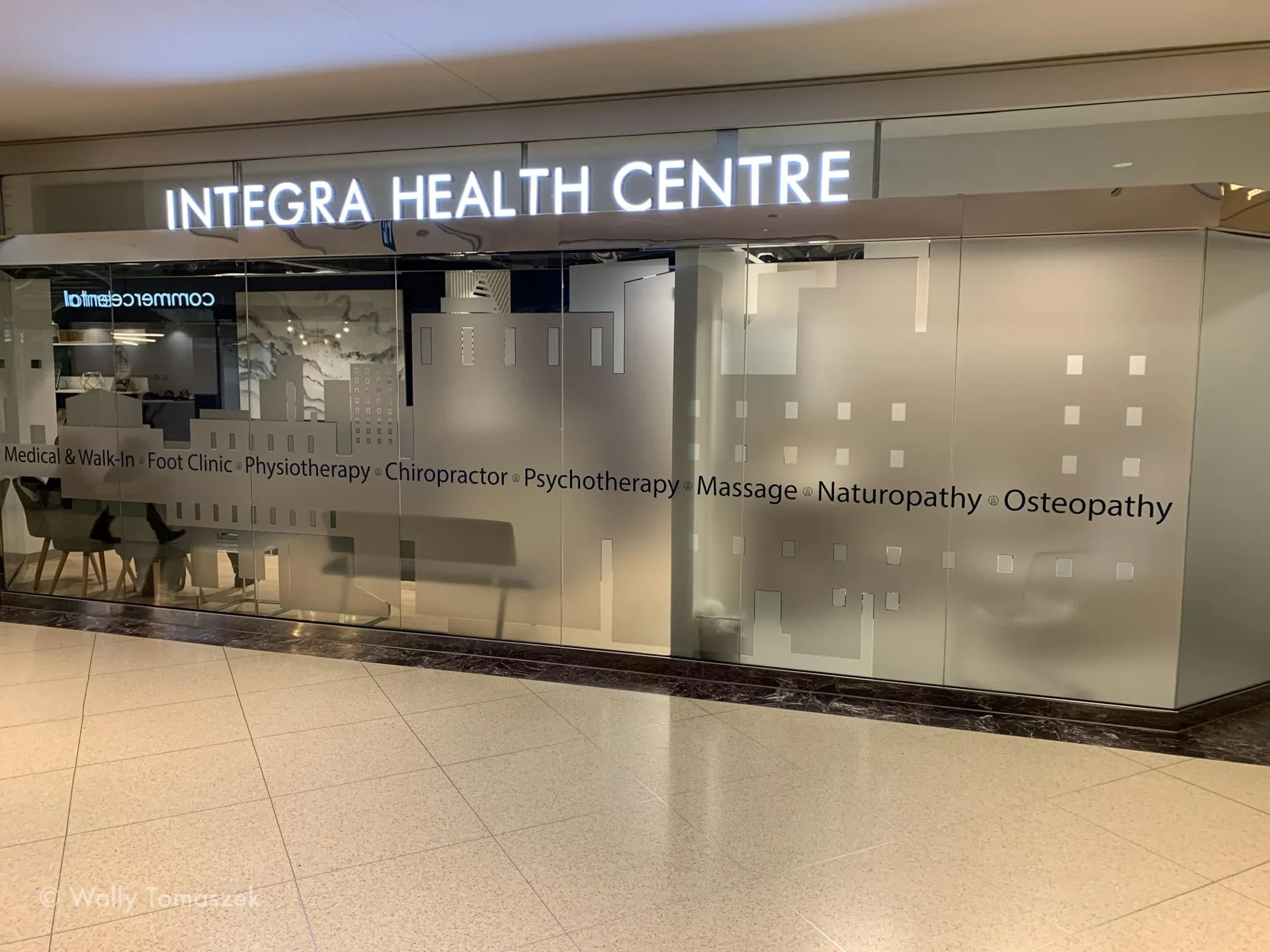 Entrance of Integra Health Centre with frosted glass doors.
