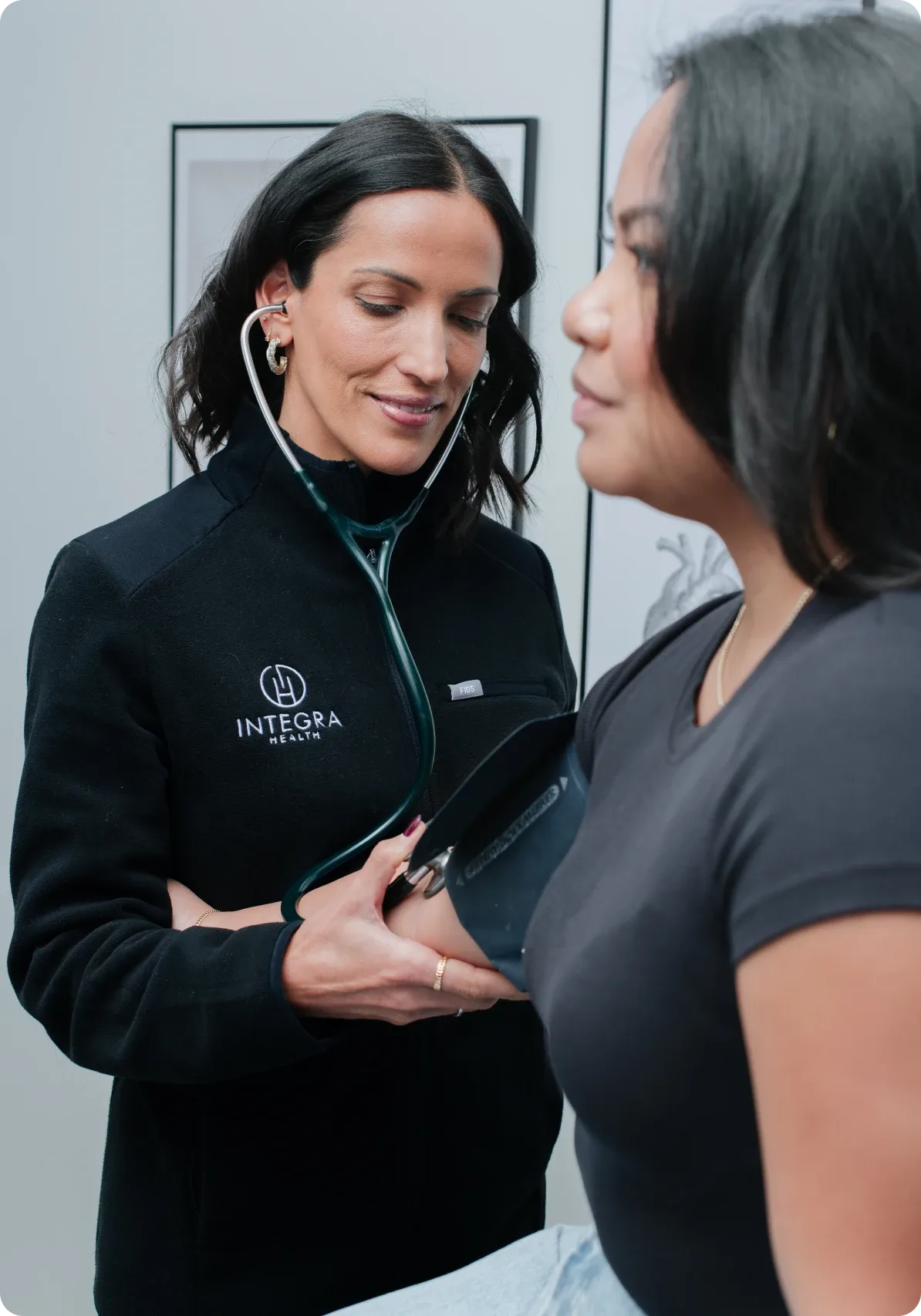 A healthcare professional checking a patient's blood pressure.