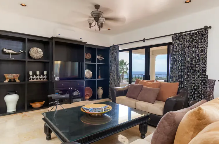 Modern living room with ocean view and decorative items