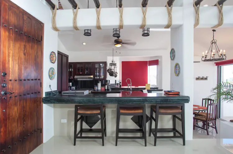 Modern kitchen with granite countertop and barstools