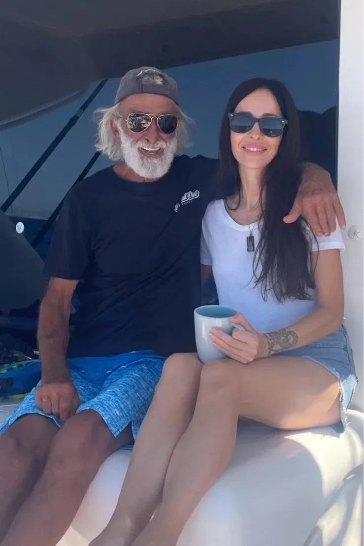 Two people sitting together on a boat