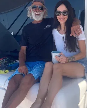 A man and woman enjoying time on a boat together.