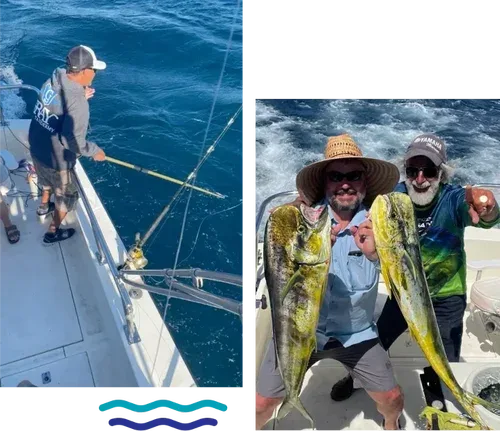 Two fishermen holding large fish on a boat.