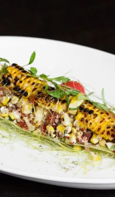Corn quinoa salad with grilled corn and fresh herbs.