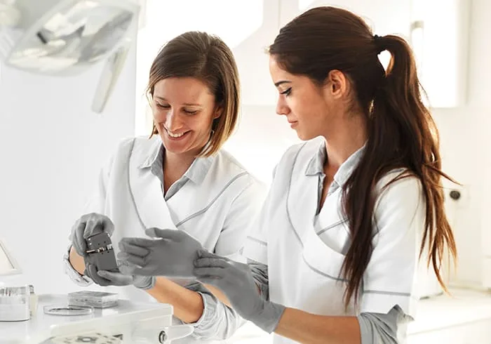 Two dentists collaborating in a bright clinic