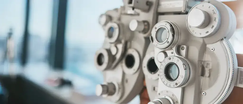 Close-up of a phoropter used for eye exams.