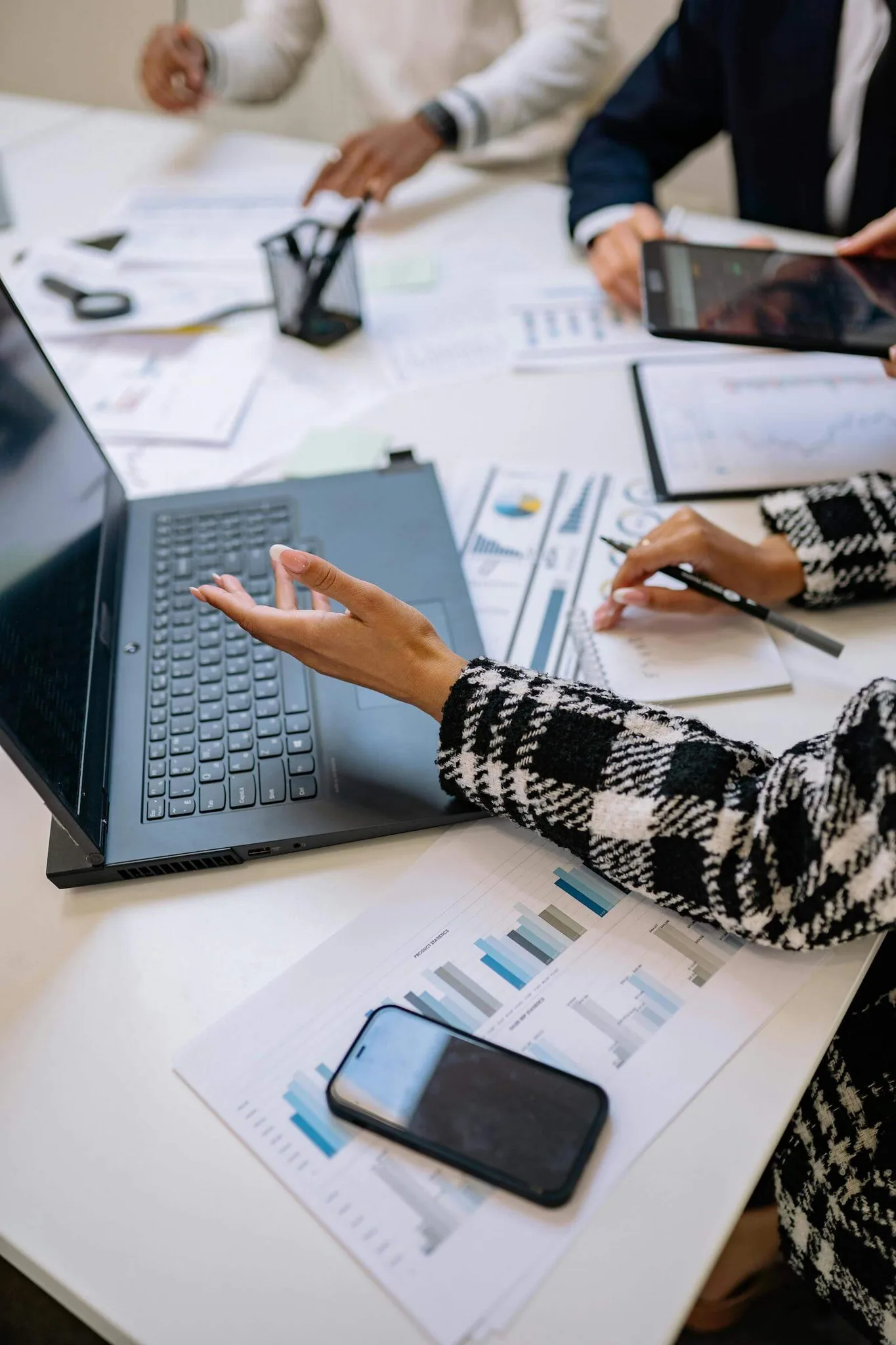 A collaborative workspace with people discussing data.