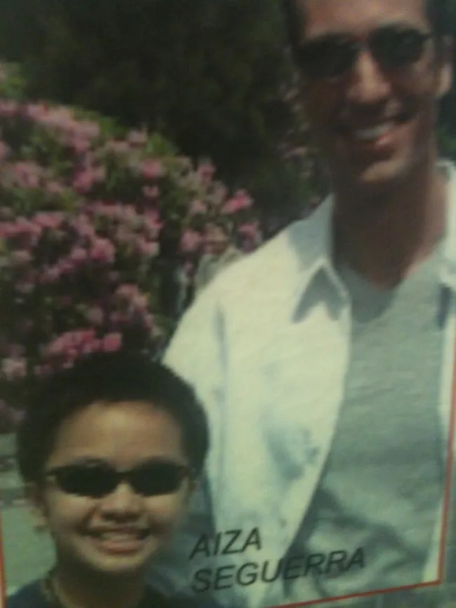 A man and a child posing together outdoors.