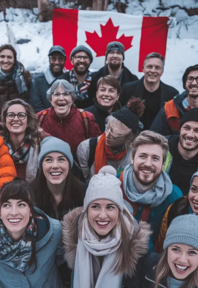 A diverse group of people smiling with a Canadian flag behind them.