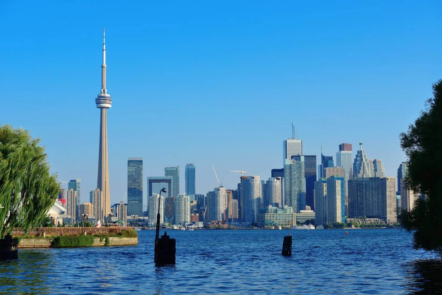 Toronto skyline with CN Tower and waterfront view.