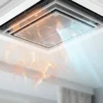 An air conditioning vent releasing warm and cool air.