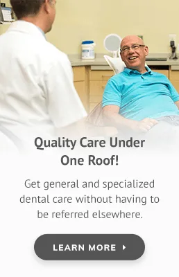 A dentist consults with a relaxed patient in a dental office.