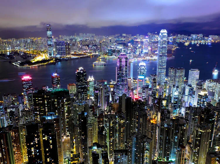 A night view of Hong Kong's illuminated skyline.