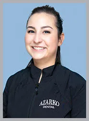 Friendly dental professional in Azarko Dental jacket.