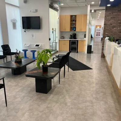Interior of a contemporary dental clinic waiting area.