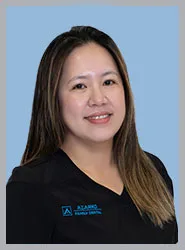 Portrait of a dental professional in uniform.