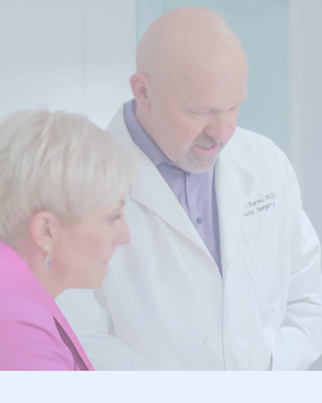 A doctor consulting with a client in a clinical setting.