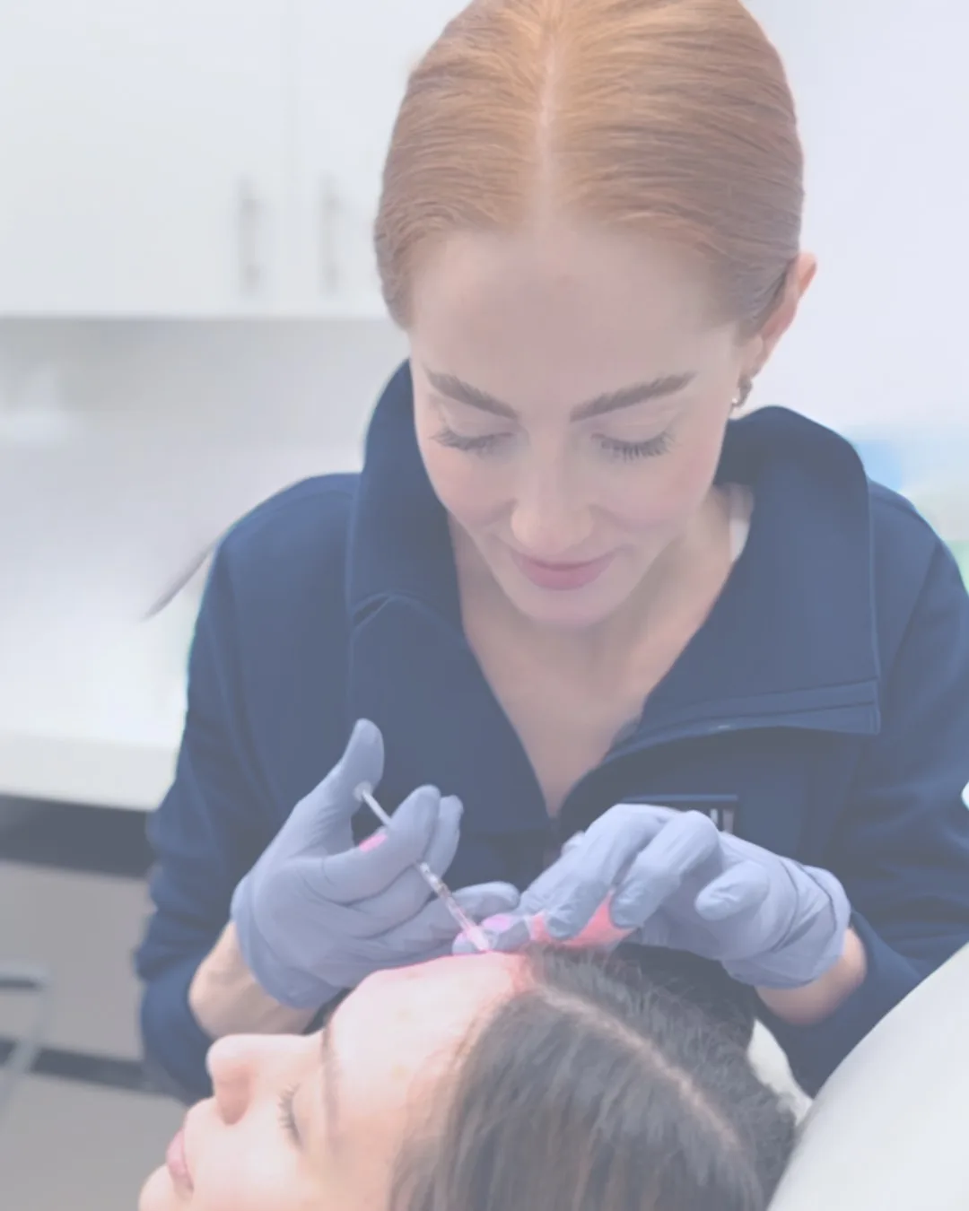 Aesthetic treatment being administered to a client.