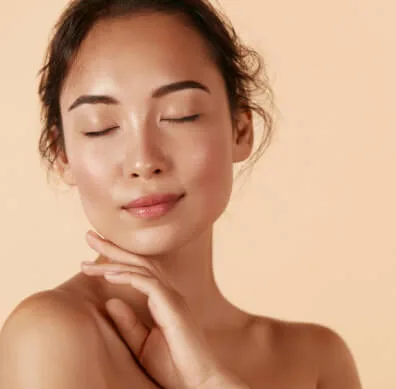 A young woman with closed eyes and smooth skin